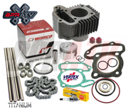 An assortment of motorcycle engine parts including a cylinder, piston, gaskets, and other components.
