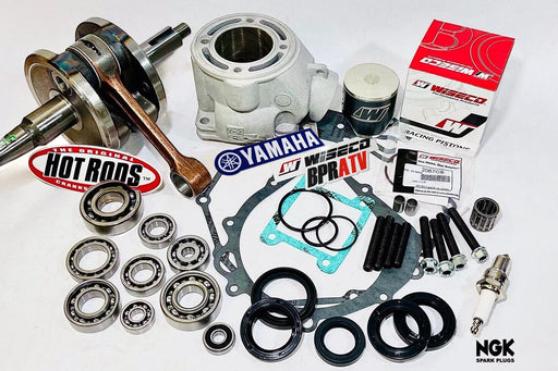 Automotive parts including bearings, gaskets, and spark plugs with brand logos on a white background